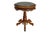 A French Empire period side table in burled walnut, circa 1890. The beveled tabletop is inset with green marble, framed...
