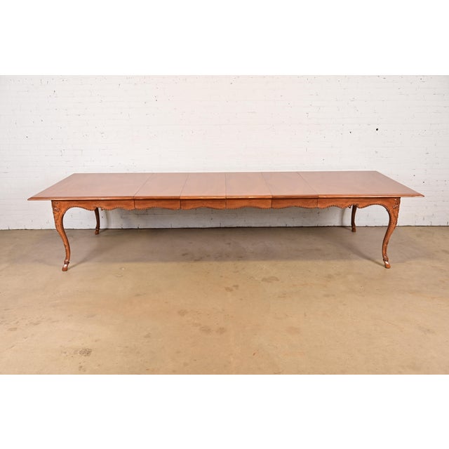 An exceptional Italian Provincial or French Provincial Louis XV style extension dining table By Baker Furniture USA, Circa...