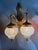 A beautiful pair of vintage French Louis XVI style wall sconces dating from the 1980s, crafted from gilded bronze with...