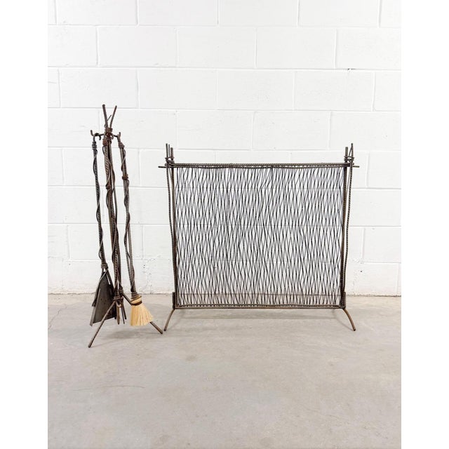 Brutalist Postmodern handmade fireplace set featuring textured, hand-forged steel rebar and spindles that twist...