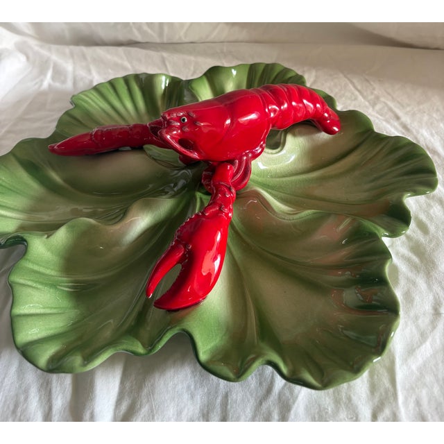 This is a rare large divided serving dish, Brad Keeler 873, featuring a red lobster atop a large lettuce leaf divided into...