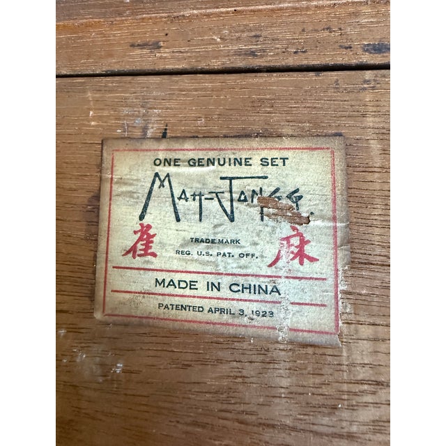 1923 Antique Chinese MahJong game set. Original bamboo base and bone top tiles. Box is a walnut stained wood with brass...