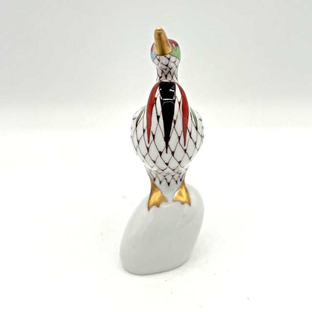 Beautiful Holloháza porcelain bird figurine featuring the distinctive and highly collectible fishnet pattern that has made...