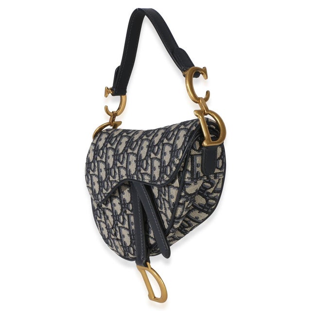 Designed by John Galliano in 1999, Dior's saddle bag made its debut on the SS00 runway. The cowboy-inspired accessory has...