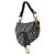 Designed by John Galliano in 1999, Dior's saddle bag made its debut on the SS00 runway. The cowboy-inspired accessory has...