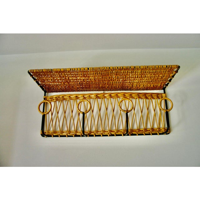 Wrought iron and wicker coat rack attributed to Jacques Adnet, circa 1960, unique braided diamond pattern, 4 individual...