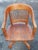 Early 20th Century Gunlocke Stained Oak Rolling and Tilting Banker's Desk Chair Measures 23.5" in width, 23.5" in depth...