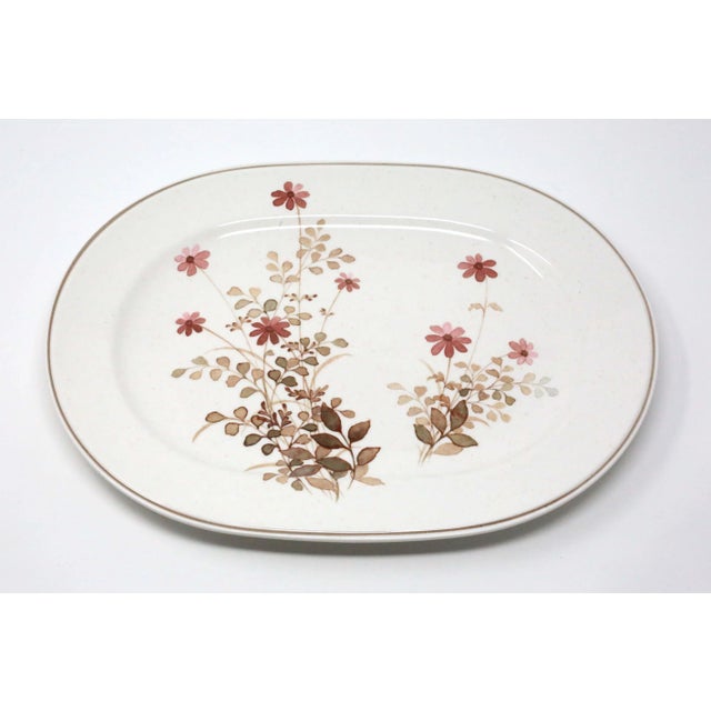 A 13" oval ceramic platter by Noritake, in the "Outlook" pattern. No chips or cracks.