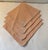 Nice set of four dinner napkins in a peach color with embroidery shell design on corner.