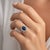 18k White gold ring with 3.09 carat Oval Blue Sapphire and 14 round brilliant diamonds weighing 1.80 carats. 6.01 grams.