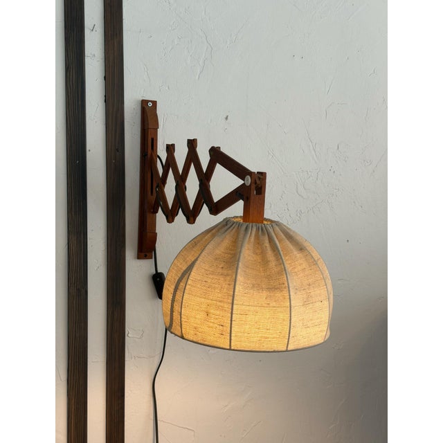 Teak Scissor Wall Lamp / Saxelampe, Denmark, 1960s A beautiful and atmospheric teak scissor wall lamp, known as a...