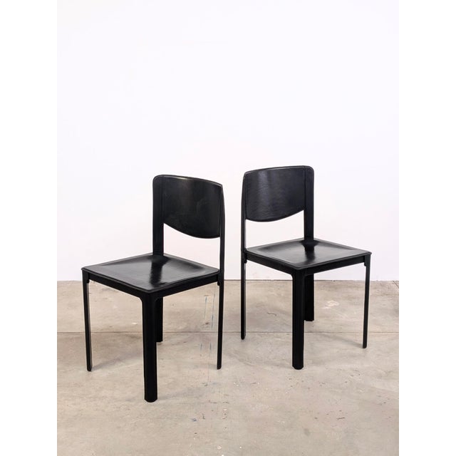 This pair of black leather chairs by Matteo Grassi is a true tribute to the company's expertise and craftsmanship in...