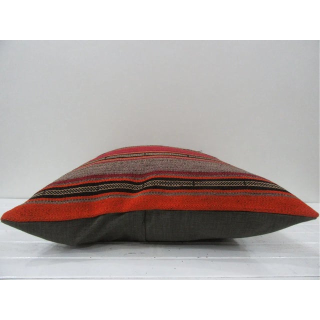 This is a pillow cover made from a vintage kilim rug. The piece was properly washed and ready to use. Pillow inserts not...