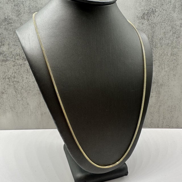 This sleek 14kt yellow gold Franco chain features a classic, tightly woven design known for its durability and modern...