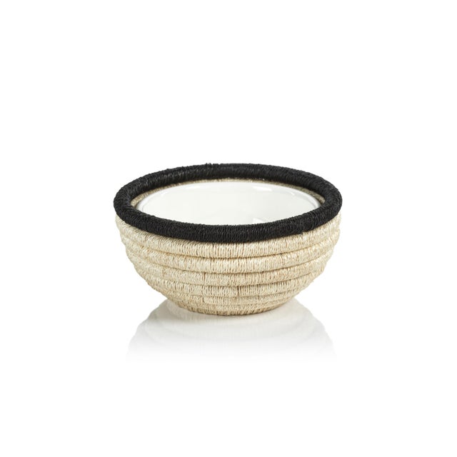 Creating beautiful presentation for your favorite condiments, our hand-woven bowl brings natural beauty and texture to the...