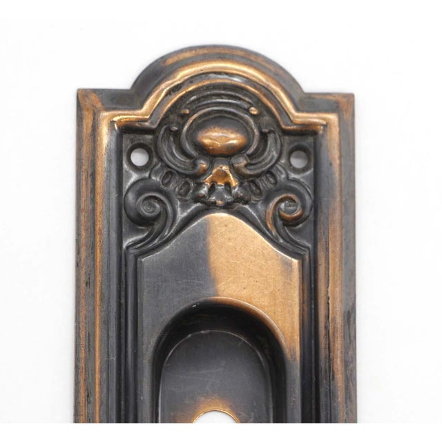 Japanned finish pocket door pull with a recessed design and keyhole. Good condition with appropriate wear from age. One...