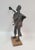 Vintage Brutalist Metal Sculpture of A Man Raising a Glass, marked "WIM", on wood base. Vintage Brutalist-style welded...
