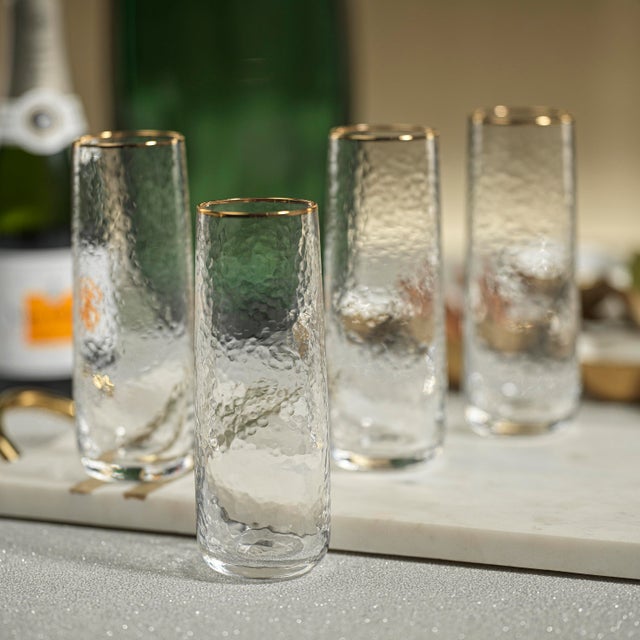 Sip in Style with the Negroni Hammered Stemless Flutes and elevate your celebrations. Crafted from high-quality soda-lime...