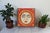 Vintage handcrafted, painted wooden sun face wall hanging or plaque featuring a prominent central sun face with a red and...