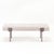 A pair of upholstered iron benches. Contemporary. The seats in a fresh white upholstery supported by bronze patina wrap...