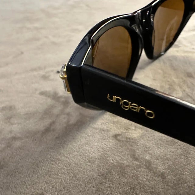 These Emmanuel Ungaro sunglasses from the 1990s encapsulate the bold and glamorous aesthetic of vintage fashion. The...
