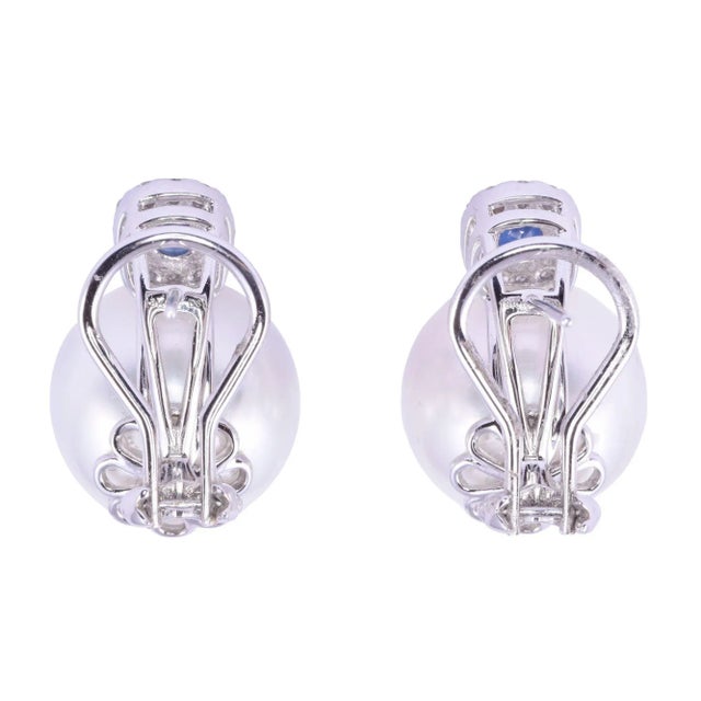 This is part of Chairish’s Fine Jewelry assortment. Estate South Seas pearl & sapphire earrings. These 18 karat white gold...