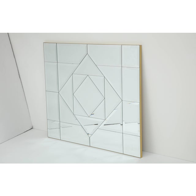 This Fabulous large designed mirror has been beautifully executed with bevelled and faceted edges and has been framed in a...