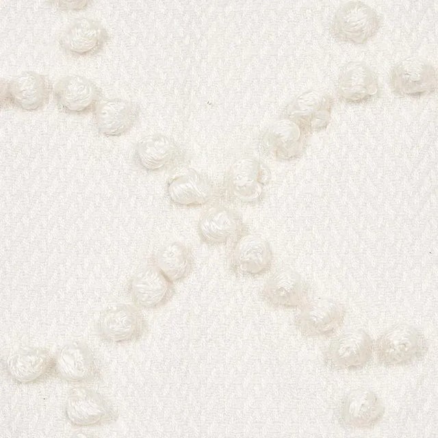 Hand-embroidered chenille French knots form a delicate and perfectly imperfect geometric pattern on a silky Cotton-Linen...