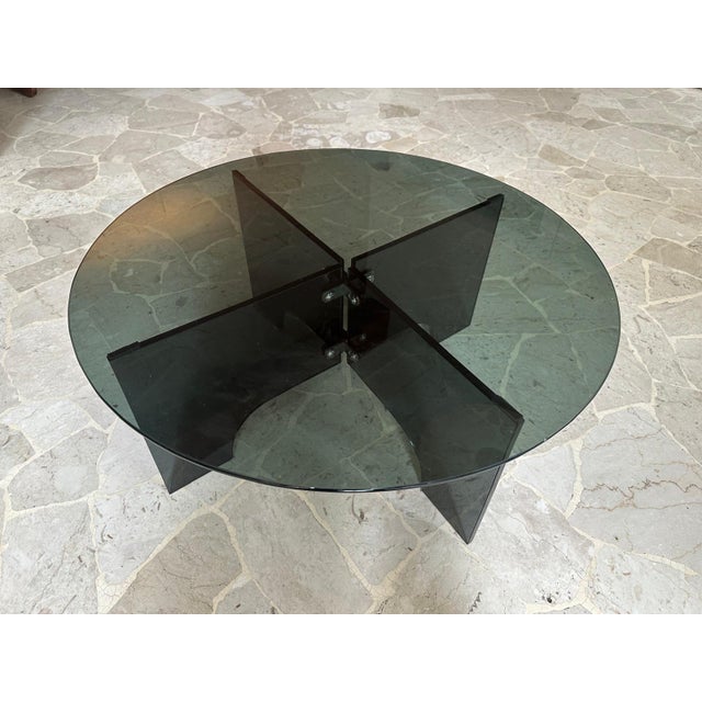 Round Coffee Table in Transparent Dark Glass, Italy, 1960s, in Flawless conditions. Designed 1960 to 1969