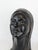 Sculpture, female head with long hair and a detailed face. Sculpture created by the Belgian artist Charles Delporte...