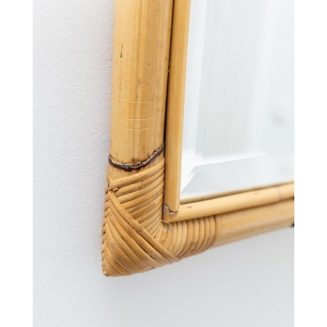 Large bamboo wall mirror in the Boho style of the 30s & 40s. The mirror used has a facet cut and is original from the time...