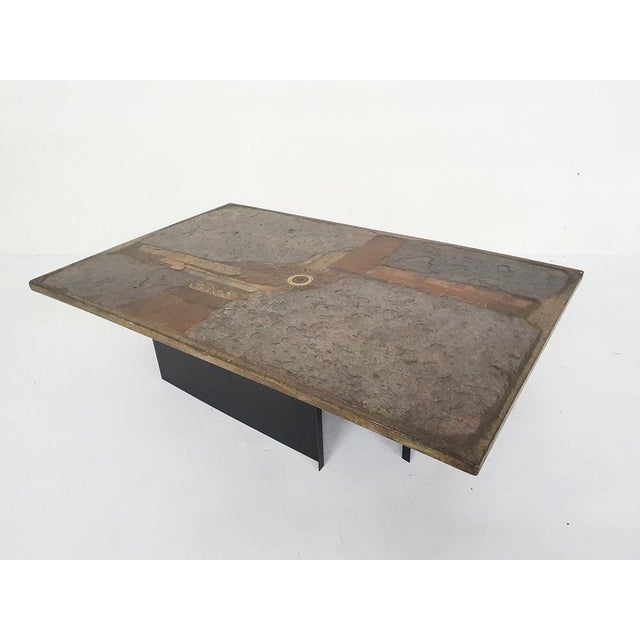 Stone coffee table on two L-shaped metal plates. Designed and signed by artist Paul Kingma. Paul Kingma Paul Kingma, born...