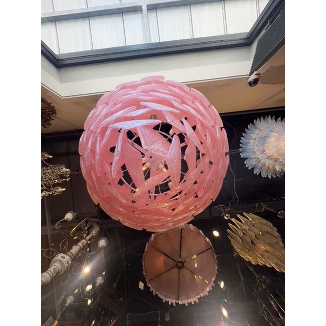 Vintage pink leaf Murano glass waterfall chandelier. That’s a really striking piece — a vintage pink-leaf Murano glass...