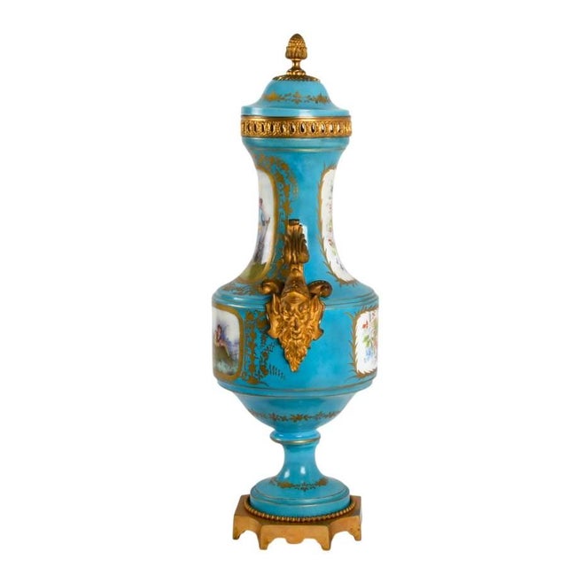 This magnificent French Sèvres-style porcelain urn is a masterful example of the opulence and artistry associated with...