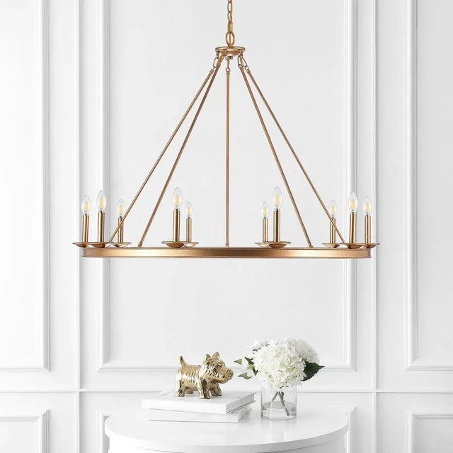 Illuminate your space with the Telta 10 Light Chandelier, an elegant centerpiece crafted from iron. The chandelier spans...