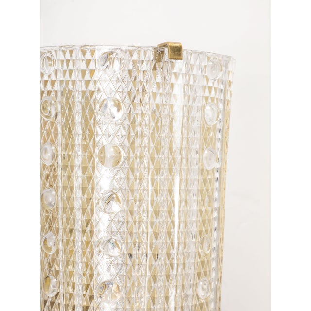 Glamorous pair of large 1960's Glass sconces designed by Carl Fagerlund for Orrefors. The Demi - lune glass has a...