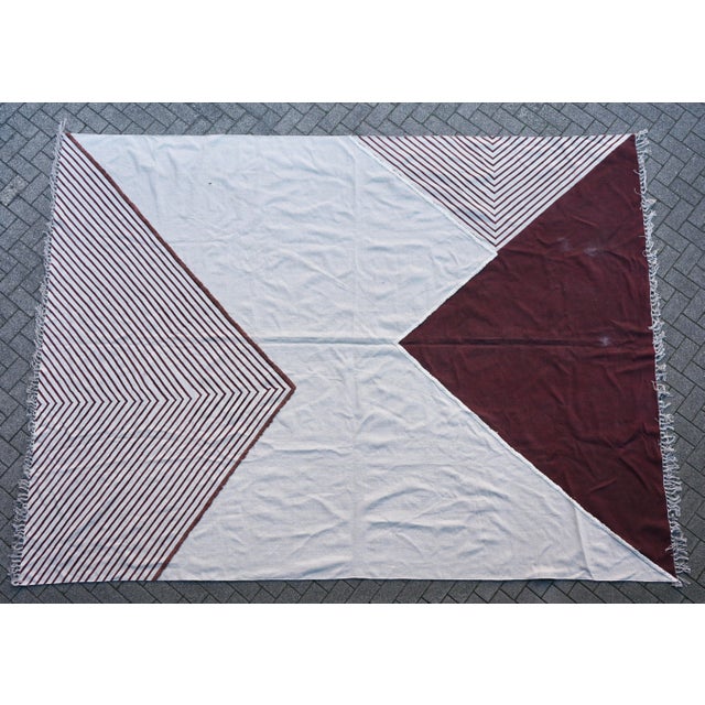 A very large woven cotton textile that could be used as a rug or as a throw for a sofa. We do not know from which country...
