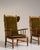 A brown wood lounge chair, dating to the 1970s and made in France. The wood frame is finished in fabric, combining...