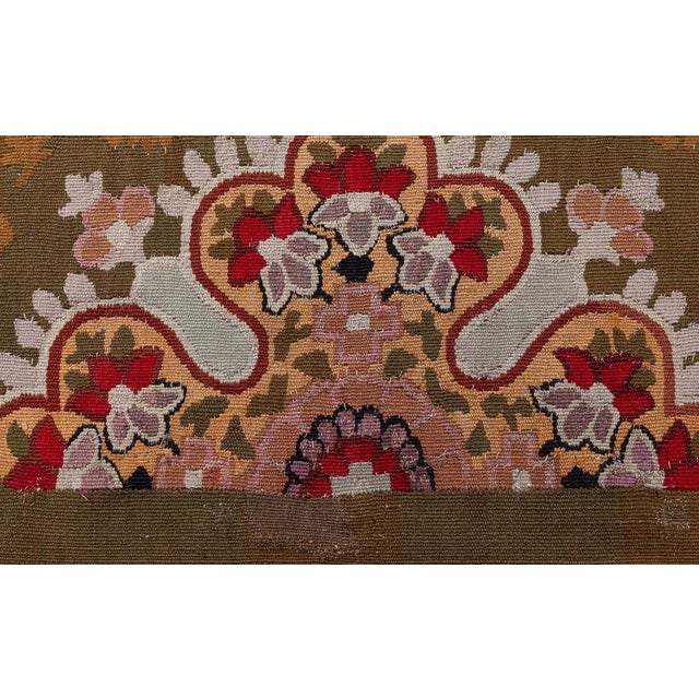 A stunning example of 19th-century French textile artistry, this antique Aubusson rug from circa 1880 captures the...