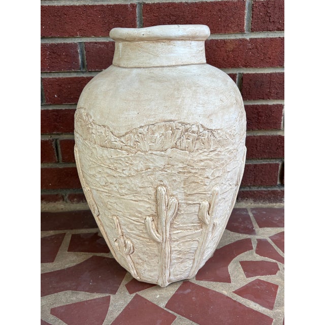 Large Postmodern cream-colored plaster floor vase with draped detailing. Please see condition details noted. Most items...