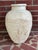 Large Postmodern cream-colored plaster floor vase with draped detailing. Please see condition details noted. Most items...