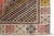 This is a vintage Turkish Oushak rug from the Mid 20th Century. The piece was hand-knotted.