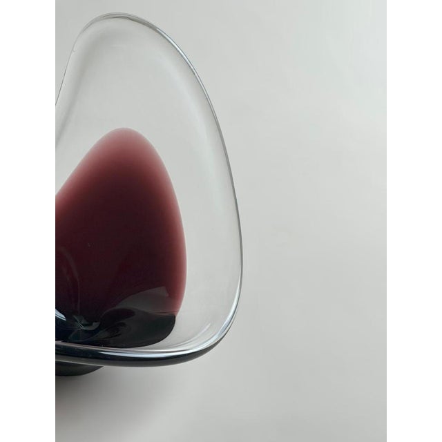 A sculptural mid-century glass bowl attributed to Paul Kedelv for Flygfors, Sweden, likely produced in the 1960s....