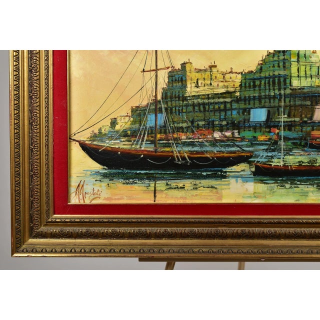 A warm Italian cityscape view with several vessels on the water. Artist signed lower left A. Apostoli for the Italian...