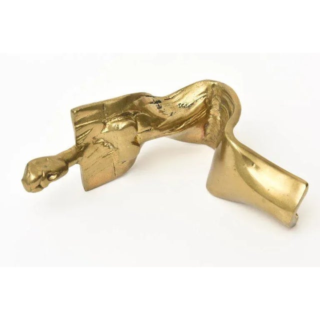This lovely cast brass vintage limited edition abstract sculpture of a seated woman is signed but not legible and it is...