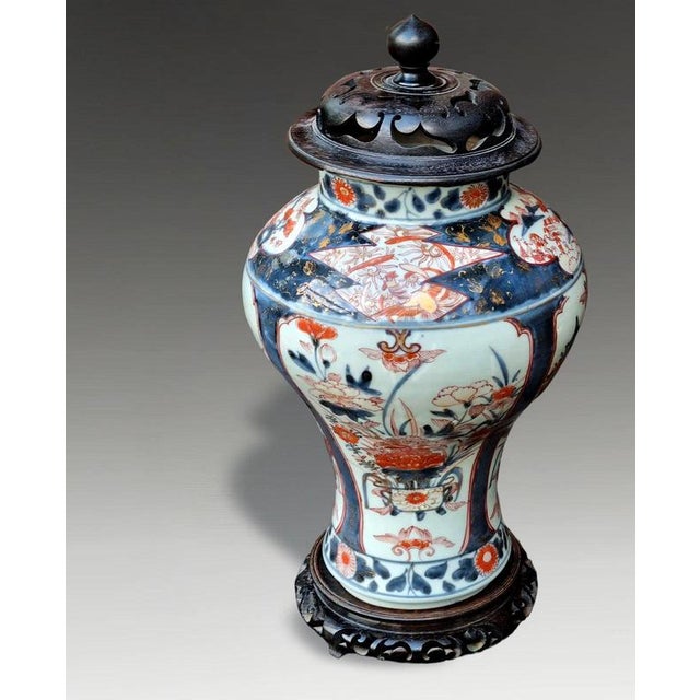 A truly outstanding large Japanese Arita Imari porcelain vase dating to circa 1700, presented with an early antique carved...