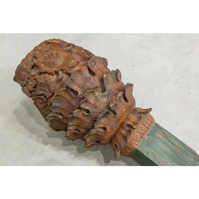 Pair of columns with shaft and capitel made of carved and polychrome wood. Capitels have a decorated relief with leafs and...