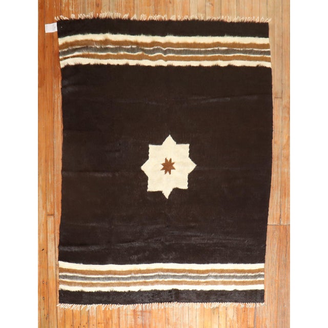 A mid 20th century black white and brown mohair rug Details rug no. r5734 size 5' x 6' 5" (152 x 196 cm)