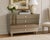 A sophisticated contemporary mirrored chest finished in subtle bronze-smoked mirror, offering a warmer and more refined...