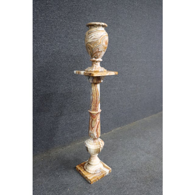 Onyx pedestal with matching urn featuring natural veining in warm tones. Square top rotates. Classic Italian style...